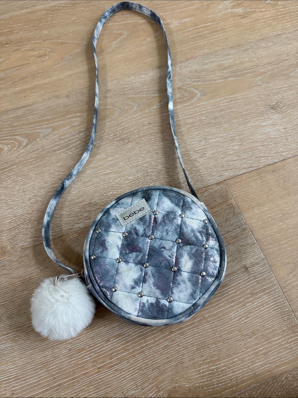 Bebe Quilted Round Crossbody Bag in Silver Gray with Pom Pom